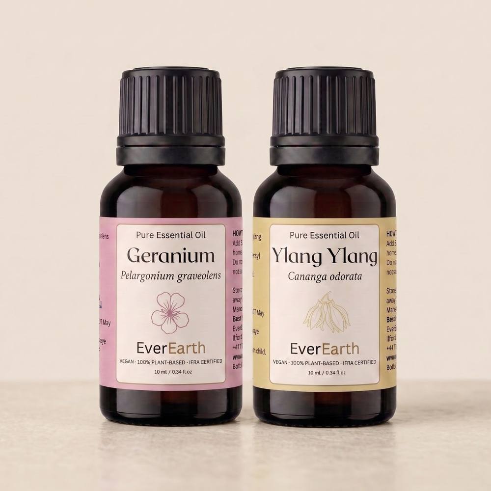 EverEarth Floral Duo, Geranium and Ylang Ylang 10ml amber glass bottles on cream marble