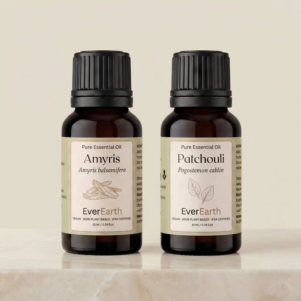 EverEarth Warm Duo, Amyris and Patchouli 10ml amber glass bottles on cream marble