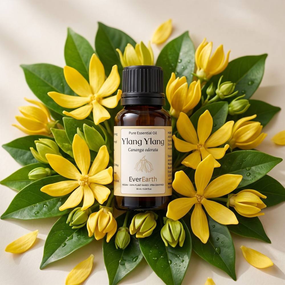 EverEarth Ylang Ylang essential oil 10ml amber bottle on a bed of fresh ylang ylang flowers
