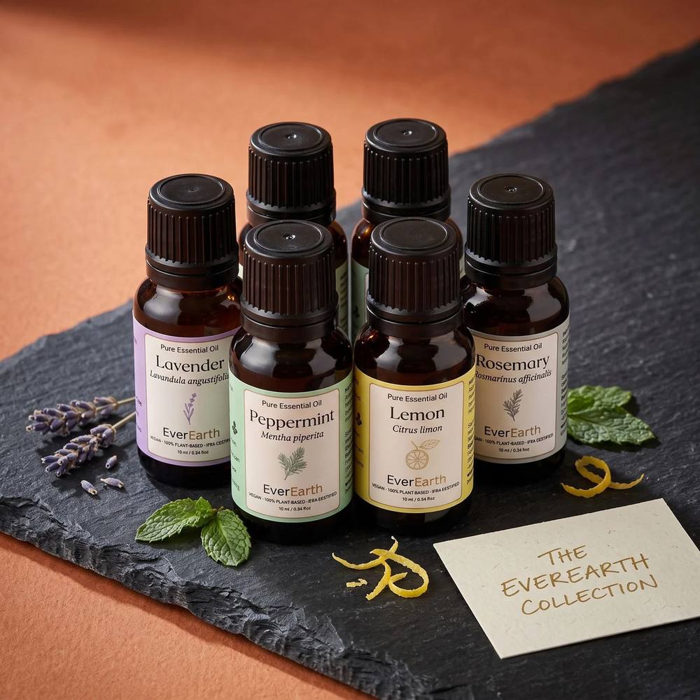 The EverEarth Collection, six essential oil bottles on slate with lavender, mint and lemon peel