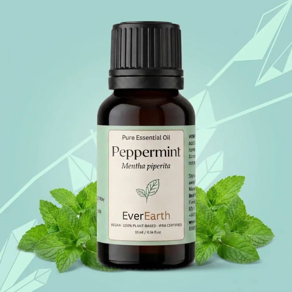 EverEarth Peppermint essential oil 10ml bottle nestled in fresh peppermint leaves