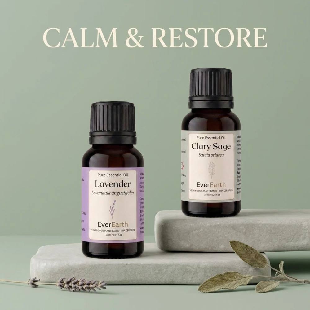 EverEarth Evening Duo on stone with lavender and sage sprigs, soft green backdrop